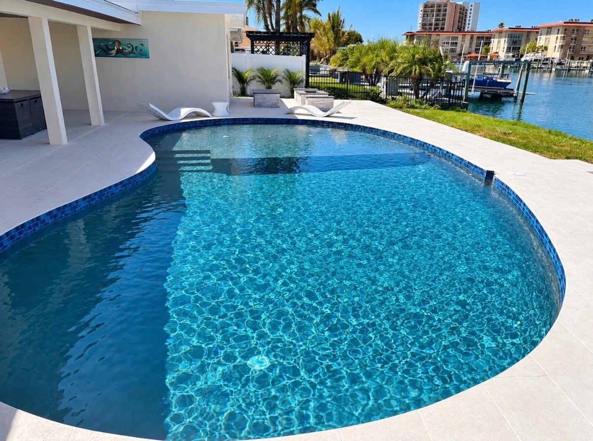 Waterfront pool with sun shelf